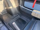 a view of the inside of a vehicle with the door open