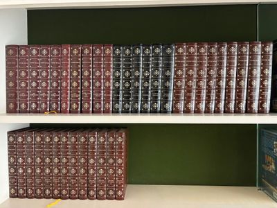 many books that are on the shelves in the room