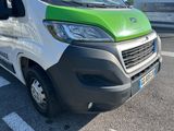 a green and white van parked on the side of the road