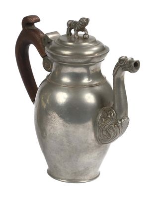 a silver teapot with a wooden handle on a white background