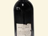 a bottle of wine that is sitting on a table
