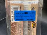 a plastic bag with a comb and a tag on it