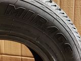 a close up of a tire on a cardboard box with a cardboard box in the background
