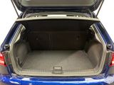 the back of a blue car with its trunk open and the back seat down