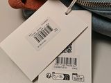 a tag on a bag with a price tag attached to it