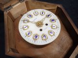 a clock that is sitting in a box on a table
