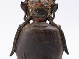 an old bronze statue of a woman with a crown on her head