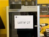 a picture of a lott machine with a lott no 27 sign on it