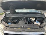 a car with the hood open and the engine in the trunk