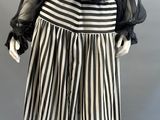 a black and white striped skirt with a sheered blouse