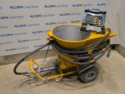 une machine jaune posée sur le sol