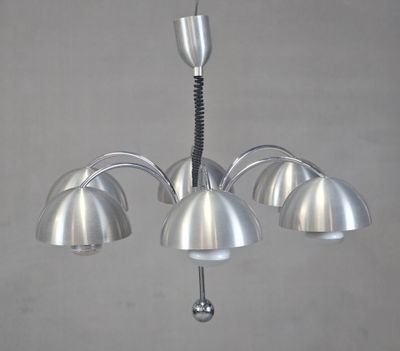 a metal chandelier with five lamps hanging from it