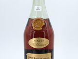 a bottle of hennesy brandy on a white background