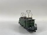 a toy train on a white surface with a white background