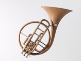 a small brass instrument that is hanging from the ceiling