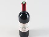 a bottle of wine that is sitting on a table
