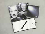 a black and white photo of marilyn monroe with a pen