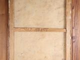 an old picture of a window with a wooden frame in it