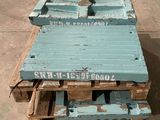 several wooden pallets are stacked on top of each other on the ground