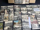 a lot of old postcards sitting on a table