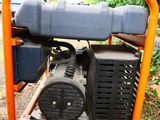a small generator that is sitting in the grass