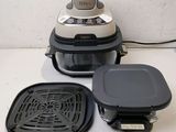 an image of a kitchen appliance that is sitting on a counter