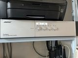 a printer sitting on top of a shelf next to a printer
