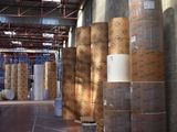 many rolls of paper in a warehouse with a lot of them
