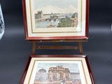 painting on easel with a picture of a city in the background