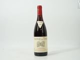 a bottle of wine that is sitting on a table