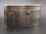 a close up of a metal box on a table