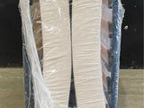 a box with two rolls of toilet paper wrapped in plastic