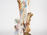a vase that has a blue base and gold decoration on it
