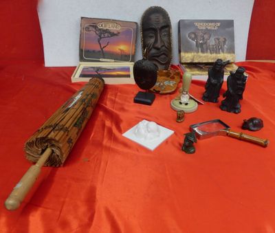 many items that are sitting on a red cloth