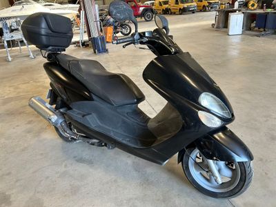 a scooter that is parked in a garage