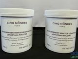 two buckets of cino mondes products sitting on a table