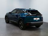 the rear view of a blue suv parked in a white room