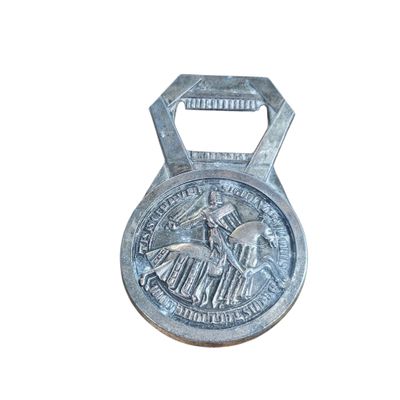 a metal bottle opener with a picture of a horse on it