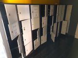 a lot of lockers that are lined up against the wall