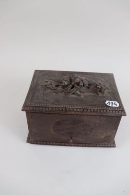 an old wooden box sitting on top of a white surface