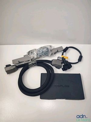 un gros plan d'un appareil muni d'un cordon et d'un chargeur