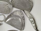 a lot of silver items that are on the table