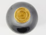 a close up of a black and gold ball