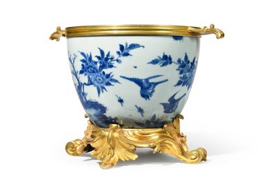 an image of a blue and white vase with a gold rim