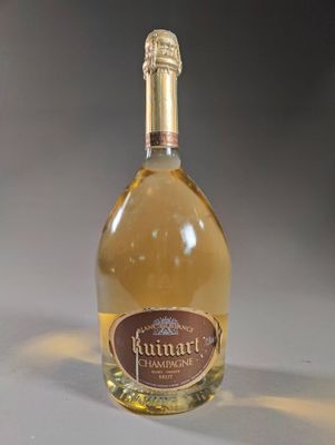 a bottle of wine that is sitting on a table