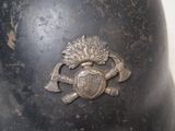 an old helmet with a coat of arms and a shield on it