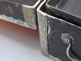 two pieces of luggage that are sitting on a table