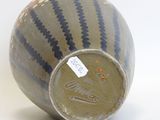 an image of a vase with a tag on it