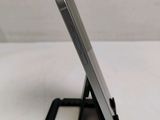 a cell phone that is sitting on top of a stand