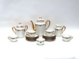 a lot of cups and saucers that are on the table